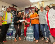 Les Filles D'esprit present a donation of $1,600 to representatives of Kenora's Makwa Patrol.