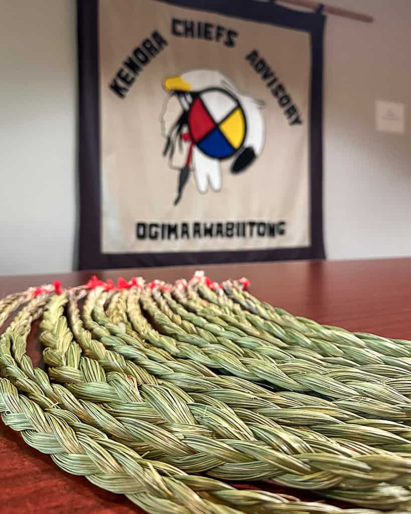 Sweetgrass braids displayed on a table at Ogimaawabiitong - Kenora Chiefs Advisory.